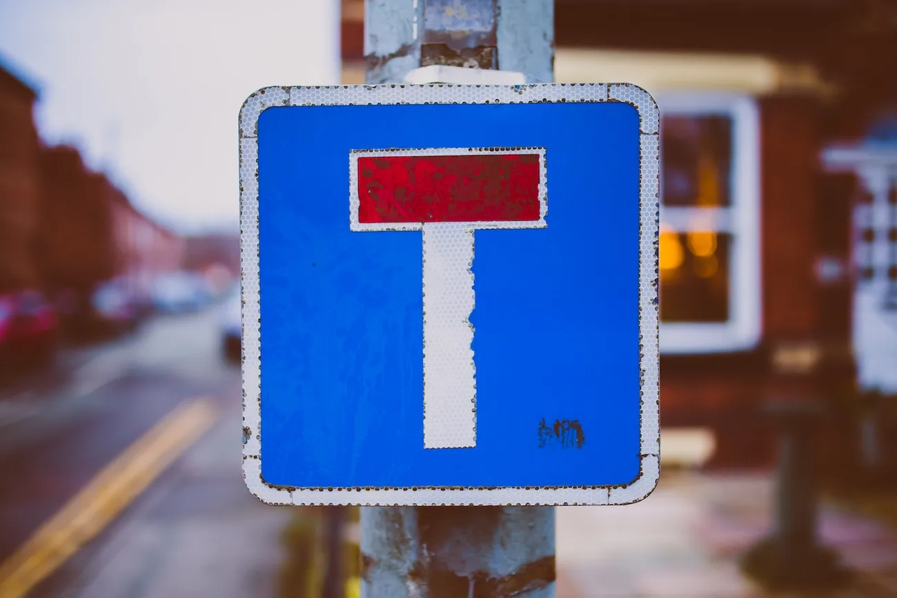 A road sign with a T representing the idea of a T-shaped profile